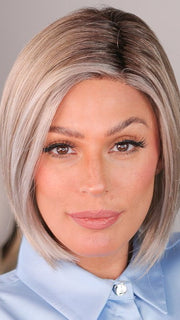 Roxie wears ELITE by ELLEN WILLE in color PEARL ROOTED | Pearl Platinum, Dark Ash Blonde, and Medium Honey Blonde mix