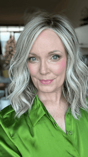 Mel B. @mels.be.ageless wearing WAVY DAY by RAQUEL WELCH WIGS in color RL17/23SS ICED LATTE MACCHIATO | Honey Blonde shaded with Cool Blonde and Dark Roots