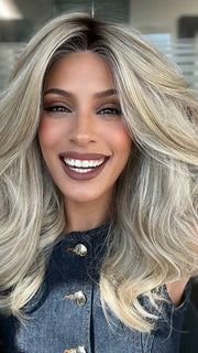 Roxie is wearing BEAUTY REIGN by GABOR in color GF19-23SS BISCUIT | Light Ash Blonde Evenly Blended with Cool Platinum Blonde with Dark Roots