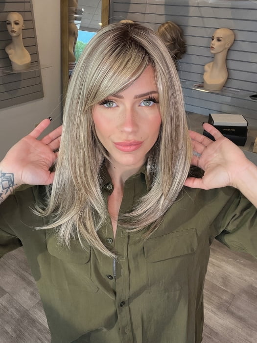 Madeline wearing CAVALLI by BELLETRESS in SPARKLING CHAMPAGNE R | Medium Ash Brown roots transition into Shimmering Champagne Blonde characterized by Pale Golden Hues with subtle Ivory and Platinum undertones reminiscent of a sparkling glass of bubbly