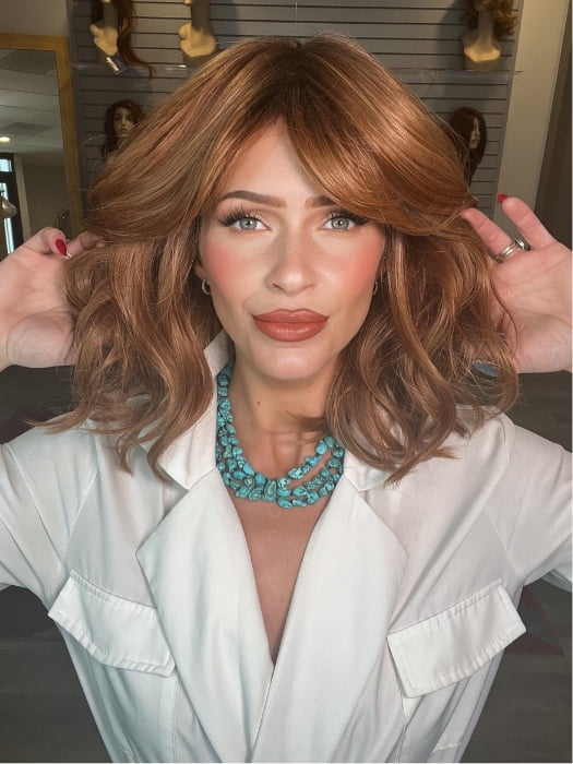 Madeline wearing HEPBURN by BELLETRESS in MIXED BERRY R | A bold, berry-inspired red with deep auburn tones and soft rooting for a natural regrowth effect.