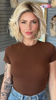 Madeline wearing NEW WAVE by TRESSALLURE in 24/102/R12 | Gold Blonde with Platinum highlights with Gold Brown roots