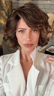 Madeline wearing HOUSTON by BELLETRESS in FRENCH ROAST BROWN-R  | A deep, luxurious brunette featuring a dark brown base with warm bronze and subtle red undertones. Softly rooted for natural depth and dimension.