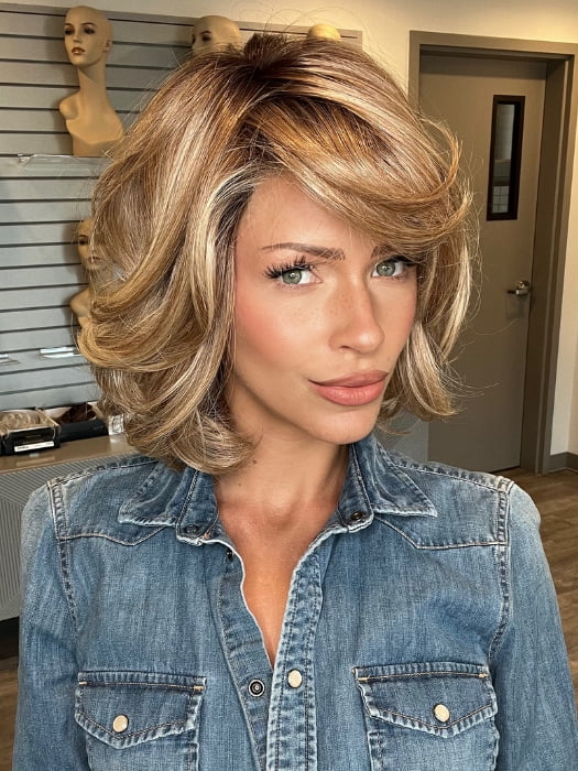 Madeline wearing CROWD PLEASER by RAQUEL WELCH in RL14/22SS SHADED WHEAT | Dark Blonde Evenly Blended with Platinum Blonde and Dark Roots