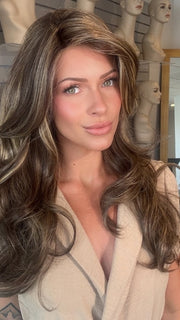 Madeline wearing LILLY by TRESSALLURE in CHOCOLATE BUTTERCREAM R | Medium and Dark Brown Rooted with a Blend of Medium Brown and Dark Blonde