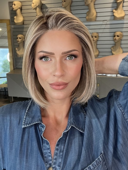 Madeline wearing BECKHAM by BELLETRESS in BUTTERCAKE BLONDE-R | A neutral-warm blonde blend featuring light brown, ash, and lightest blonde tones with natural-looking darker roots for added depth and realism.