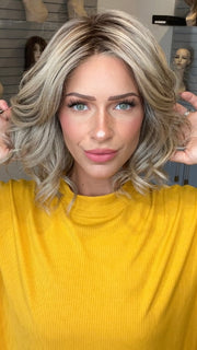 Madeline wearing ISSEY by BELLETRESS in SPARKLING CHAMPAGNE R | Medium Ash Brown roots transition into Shimmering Champagne Blonde characterized by Pale Golden Hues with subtle Ivory and Platinum undertones reminiscent of a sparkling glass of bubbly