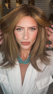 Madeline wearing PIANA by BELLETRESS in BUTTER PECAN R | A blonde/red blend with a golden-beige base swirled with soft, buttery highlights and light caramel pecan lowlights.