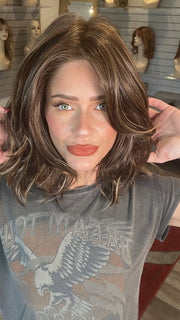 Madeline wearing MODENA by BELLETRESS in DARK BROWN HL | A Blend of Dark Brown, Strawberry Light Auburn and Soft Chunky Medium and Dark Blonde Highlights