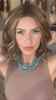Madeline wearing SPADE by BELLETRESS in TOASTED WALNUT R | Medium Brown Rooted, Ash Brown, Medium Gold Blonde, and Light Brown Blended to perfection