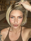 Madeline is wearing SMOOTH CUT BOB by TRESSALLURE in 24/102/R12 | Gold Blonde with Platinum Highlights with Gold Brown Roots