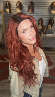 Madeline wearing BROOKLYN by RENE OF PARIS in HENNA-RED-R | Bright and Vibrant Red with Cherry Undertones, Rooted with Rich Coffee Bean Brown