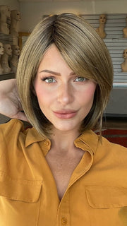 Madeline is wearign ALL THE RAGE by GABOR in GF12-22SS SHADED CAPPUCCINO | Light Golden Brown Evenly Blended with Cool Platinum Blonde Highlights with Dark Roots