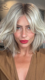 Madeline wearing EMILIA by BELLETRESS in BUTTERBEER R | Dark Brown Base and Root that transitions smoothly into a buttery blonde, infused with creamy honey and toffee tones
