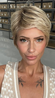 Madeline wearing PALO ALTO by BELLETRESS in RAW SUGAR BLONDE | A Neutral Light Blonde, Honey Blonde, Pale Gold Blonde, with a base of Light Brown Low Lights featuring a Medium Root Color
