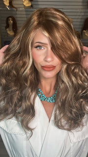 Madeline wearing SARAH by JON RENAU in FS26/31 Caramel Syrup | Amber Red w/ Caramel Blonde Highlights