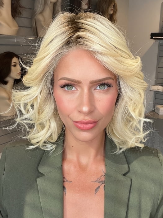 Madeline wearing EDITOR'S PICK ELITE by RAQUEL WELCH in RL613SS SHADED PLATINUM | Dark Brown roots with Warm Platinum Blonde