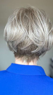 Mel B. @mels.be.ageless wearing IGNITE by JON RENAU in color 56F51 OYSTER | Light Grey with 20% Medium Brown Front, graduating to Grey with 30% Medium Brown Nape