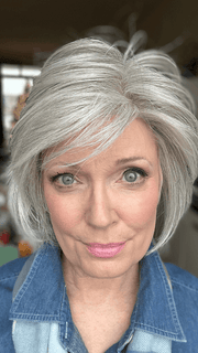 Mel B. @mels.be.ageless wearing FLIRTING WITH FASHION by RAQUEL WELCH WIGS in color RL56/60 SILVER | Lightest Gray Evenly Blended with Pure White