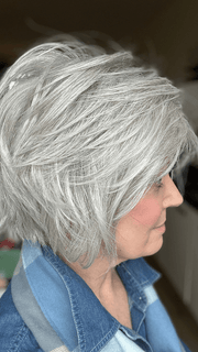 Mel B. @mels.be.ageless wearing FLIRTING WITH FASHION by RAQUEL WELCH WIGS in color RL56/60 SILVER | Lightest Gray Evenly Blended with Pure White