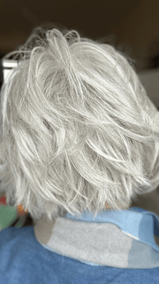 Mel B. @mels.be.ageless wearing FLIRTING WITH FASHION by RAQUEL WELCH WIGS in color RL56/60 SILVER | Lightest Gray Evenly Blended with Pure White