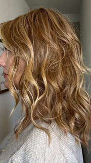 Jenny B. @thewiggygirl wearing BEACH WAVE MAGIC by TRESSALLURE in color 14/26/R10 | Red Blonde with Gold Blonde highlights and Light Brown roots