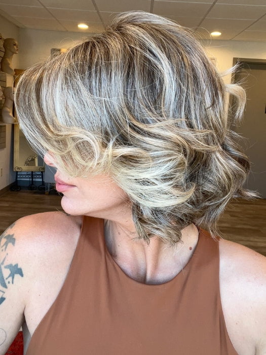Madeline is wearing FLIRT ALERT by RAQUEL WELCH in RL12/22SS SHADED CAPPUCCINO | Light Golden Brown Evenly Blended with Cool Platinum Blonde Highlights with Dark Roots