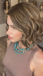 Madeline wearing SPADE by BELLETRESS in TOASTED WALNUT R | Medium Brown Rooted, Ash Brown, Medium Gold Blonde, and Light Brown Blended to perfection