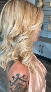 Madeline wearing MILLION DOLLAR BABE by TRESSALLURE in 24/102/R12 | Gold Blonde with Platinum Highlights with Gold Brown Roots
