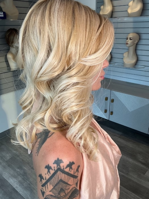Madeline wearing MILLION DOLLAR BABE by TRESSALLURE in 24/102/R12 | Gold Blonde with Platinum Highlights with Gold Brown Roots