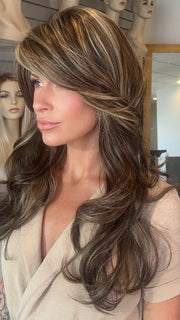 Madeline wearing LILLY by TRESSALLURE in CHOCOLATE BUTTERCREAM R | Medium and Dark Brown Rooted with a Blend of Medium Brown and Dark Blonde