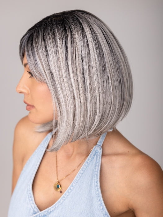 ROXIE wearing CARLEY by ENVY in STERLING SHADOW | Medium Salt-and-Pepper Grey with Darker Brown Roots