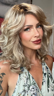Madeline wearing FINN by ESTETICA in RH1488RT8 | Dark Blonde with Light Copper Blonde Highlights & Golden Brown Roots