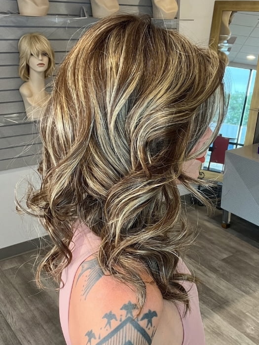 Madeline wearing ELLE by BELLETRESS in CAPPUCINO LATTE R | A Deep brunette with light brown highlights and lowlights