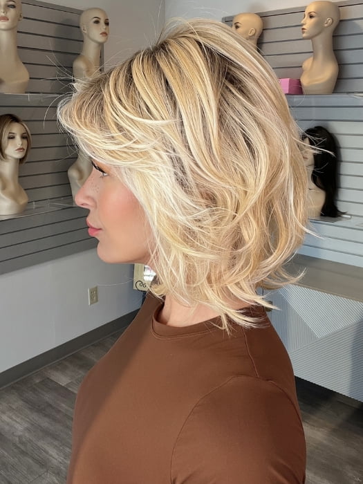 Madeline wearing NEW WAVE by TRESSALLURE in 24/102/R12 | Gold Blonde with Platinum highlights with Gold Brown roots