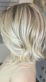 Madeline wearing FARREN by AMORE in MELTED-SAND | Rich, warm brown root melts into the neutral blond tone. Light-beige blond ends complete this stunning color.