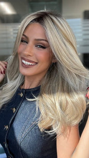 Roxie is wearing BEAUTY REIGN by GABOR in color GF19-23SS BISCUIT | Light Ash Blonde Evenly Blended with Cool Platinum Blonde with Dark Roots