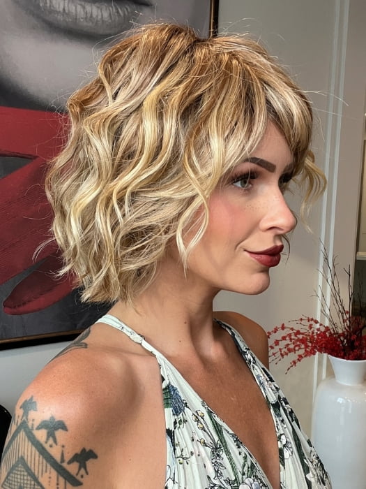 Madeline wearing TREND by TRESSALLURE in 14/26/R10 | Red Blonde with Gold Blonde Highlights and Light Brown Roots