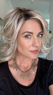 Jenny @thewiggygirl wearing CROWD PLEASER by RAQUEL WELCH in color RL19/23SS SHADED BISCUIT | Light Ash Blonde Evenly Blended with Cool Platinum Blonde and Dark Roots
