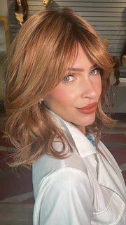 Madeline wearing HEPBURN by BELLETRESS in MIXED BERRY R | A bold, berry-inspired red with deep auburn tones and soft rooting for a natural regrowth effect.