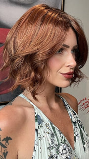 Madeline wearing TARA by RENE OF PARIS in  SHADED-AMBER | Coppery Blonde and Red Blend with Dark Amber Brown Roots