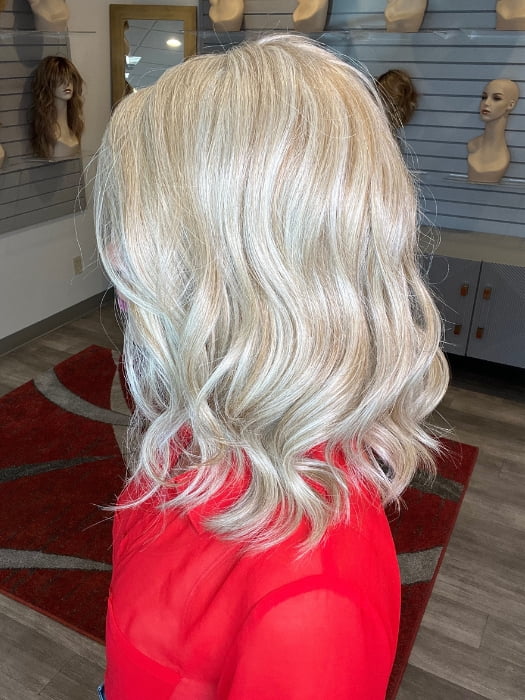Madeline wearing BELLA VIDA BY RAQUEL WELCH in RL19/23 BISCUIT | Light Ash Blonde Evenly Blended with Cool Platinum Blonde