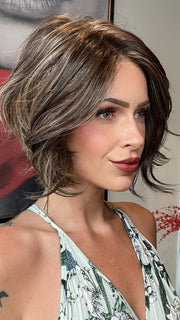 Madeline wearing LOS ANGELES by BELLETRESS in DARK BROWN HL | A Blend of Dark Brown, Strawberry Light Auburn and Soft Chunky Medium and Dark Blonde Highlights.