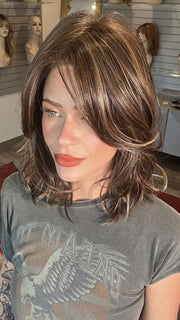 Madeline wearing MODENA by BELLETRESS in DARK BROWN HL | A Blend of Dark Brown, Strawberry Light Auburn and Soft Chunky Medium and Dark Blonde Highlights