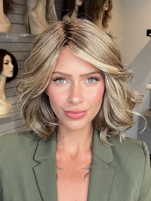 Madeline wearing EDITOR'S PICK ELITE by RAQUEL WELCH in RL12/22SS SHADED CAPPUCCINO | Light Golden Brown Evenly Blended with Cool Platinum Blonde Highlights with Dark Roots