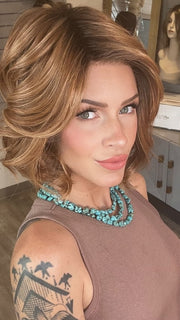 Madeline wearing TWAIN by BELLETRESS in MIXED BERRY R | A bold, berry-inspired red with deep auburn tones and soft rooting for a natural regrowth effect.