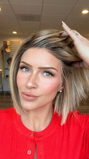 Madeline is wearing SANTA MONICA by BELLETRESS in RAW SUGAR BLONDE | A Neutral Light Blonde, Honey Blonde, Pale Gold Blonde, with a base of Light Brown Low Lights featuring a Medium Root Color