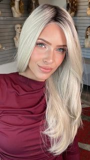 Madeline wearing STAY THE NIGHT by RAQUEL WELCH in RL16/22SS SHADED ICED SWEET CREAM | Pale Blonde with Slight Platinum Highlighting with Dark Roots
