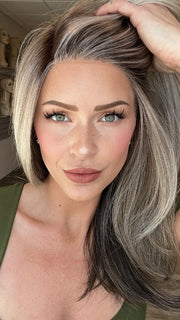 Madeline is wearing CHARMING by TRESSALLURE in 52/38/49/R8 | 3 Tones of Grey blended with Dark Brown Roots