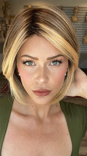 Madeline is wearing POISED by TRESSALLURE in EL17/23/R8 | Pale Auburn Beige Blonde Blend, Rooted Medium Brown, Highlighted Light Blonde with face framimg highlights